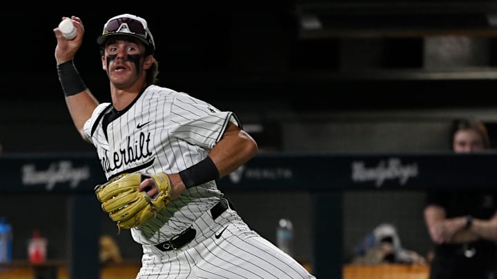 Vanderbilt third baseman Brodie Johnston (9) tries to throw out Louisville's Alex Alicea during the ninth inning of the Nashville Regional NCAA Baseball Tournament game at Hawkins Field Saturday, May 31, 2025, in Nashville, Tenn.