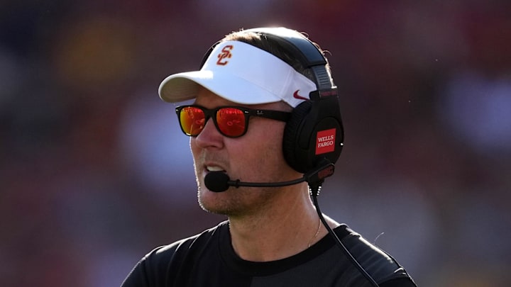 Aug 30, 2025; Los Angeles, California, USA; Southern California Trojans head coach Lincoln Riley watches from the sidelines against the Missouri State Bears in the first half at United Airlines Field at Los Angeles Memorial Coliseum. Mandatory Credit: Kirby Lee-Imagn Images