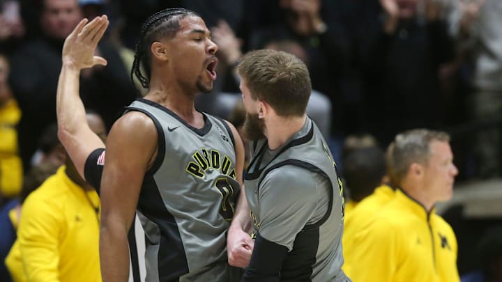 Purdue guards C.J. Cox (0) and Braden Smith (3) celebrate Purdue guards C.J. Cox (0) and Braden Smith (3) celebrate