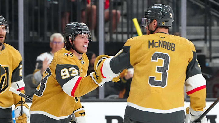 Mitch Marner celebrates with Brayden McNabb after scoring one of his two second-period goals