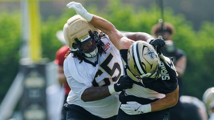 Jul 30, 2026; Metairie, LA, USA;  New Orleans Saints guard Jeremiah Wright  (64)  blocks New Orleans Saints linebacker Jackson Sirmon (45) during training camp at Ochsner Sports Performance Center. Mandatory Credit: Stephen Lew-Imagn Images