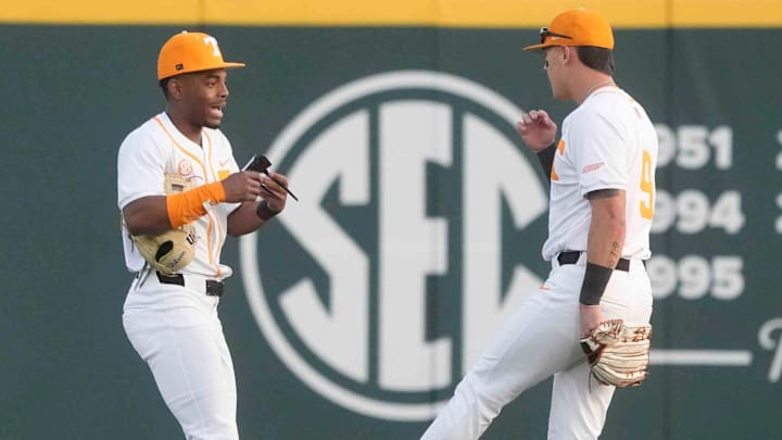 Tennessee infielder/outfielder Jay Abernathy (8) and Tennessee outfielder Hunter Ensley (9) chat in the outfield at the Tennessee baseball season opener against Hofstra, in Lindsey Nelson Stadium at University of Tennessee in Knoxville, Tenn., Friday, February. 14, 2025.