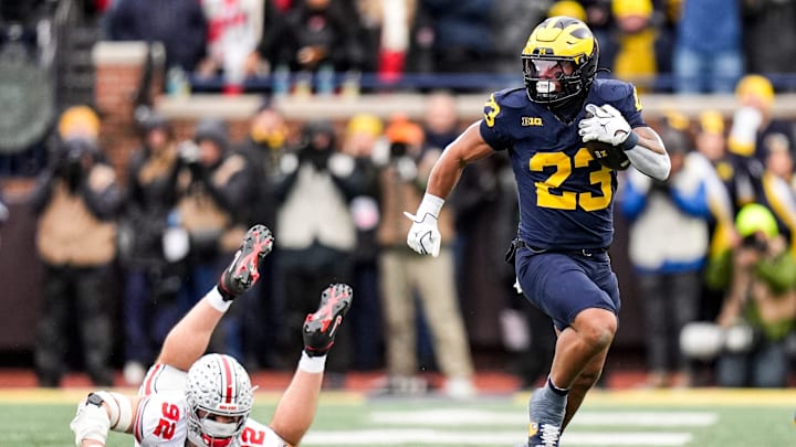 Michigan running back Jordan Marshall (23) runs against Ohio State during the first half at Michigan Stadium in Ann Arbor on Saturday, Nov. 29, 2025.