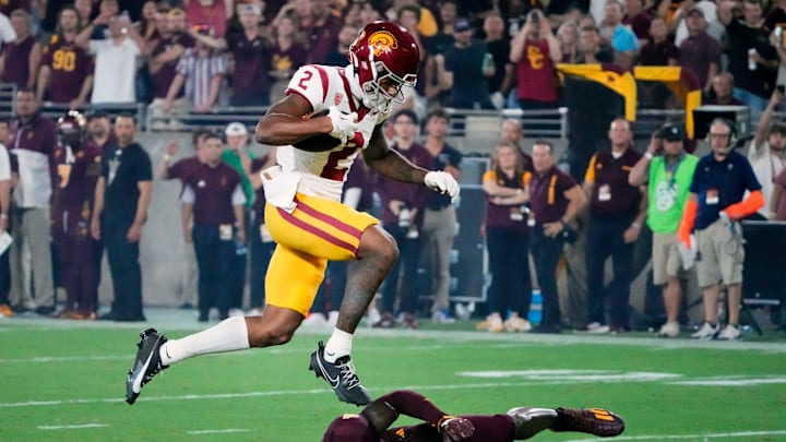 USC Trojans wide receiver Brenden Rice (2) jumps over Arizona State Sun Devils defensive back.