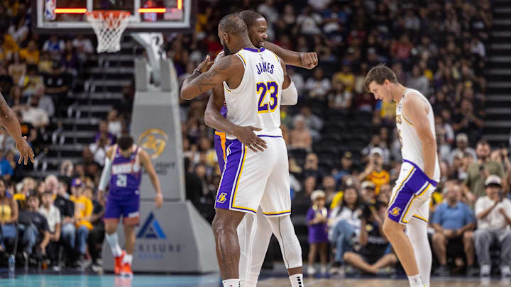 Oct 6, 2024; Palm Desert, California, USA; Phoenix Suns forward Kevin Durant (35) hugs Los Angeles Lakers forward LeBron James (23) during pregame at Acrisure Arena. Mandatory Credit: David Frerker-Imagn Images