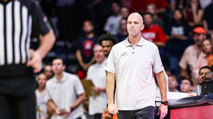 Feb 7, 2026; Tucson, Arizona, USA; Oklahoma State Cowboys head coach Steve Lutz watches from the sidelines during the first half of the game against the Arizona Wildcats at McKale Memorial Center. Mandatory Credit: Aryanna Frank-Imagn Images