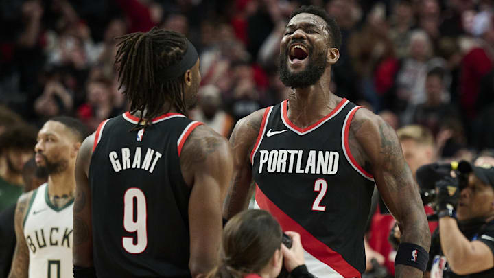Jan 31, 2024; Portland, Oregon, USA; Portland Trail Blazers center Deandre Ayton (2) celebrates with forward Jerami Grant (9) after beating the Milwaukee Bucks at Moda Center. Mandatory Credit: Troy Wayrynen-Imagn Images