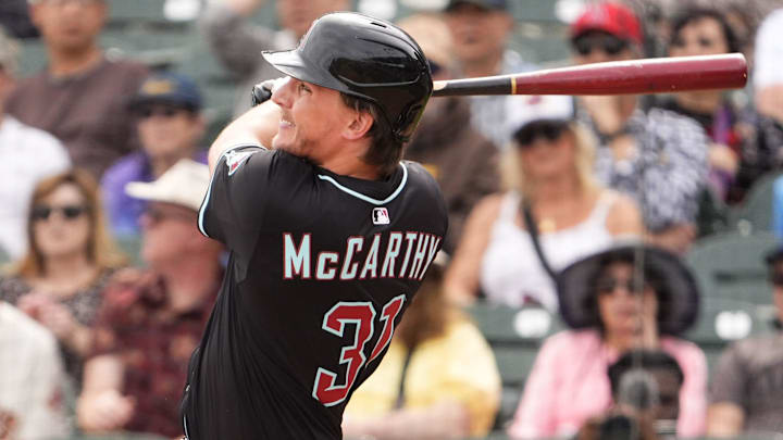 Arizona Diamondbacks outfielder Jake McCarthy hits a double against the San Francisco Giants in the first inning during a spring training game at Salt River Fields on March 5, 2025, in Scottsdale. Arizona Diamondbacks outfielder Jake McCarthy hits a double against the San Francisco Giants in the first inning during a spring training game at Salt River Fields on March 5, 2025, in Scottsdale.