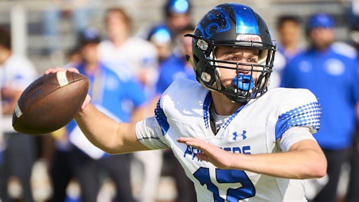 Paradise Honors Panthers quarterback Gage Baker (12) makes a pass against Valley Christian Trojans at Mesa High School in Mesa on Saturday, Nov. 18, 2023. Alex Gould/Special for The Republic