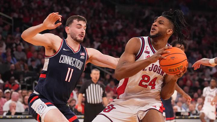 Mar 14, 2026; New York, NY, USA; St. John's Red Storm forward Zuby Ejiofor (24) looks to shoot over Connecticut Huskies forward Alex Karaban (11) during the first half of the men's Big East Conference Tournament Championship at Madison Square Garden. Mar 14, 2026; New York, NY, USA; St. John's Red Storm forward Zuby Ejiofor (24) looks to shoot over Connecticut Huskies forward Alex Karaban (11) during the first half of the men's Big East Conference Tournament Championship at Madison Square Garden.