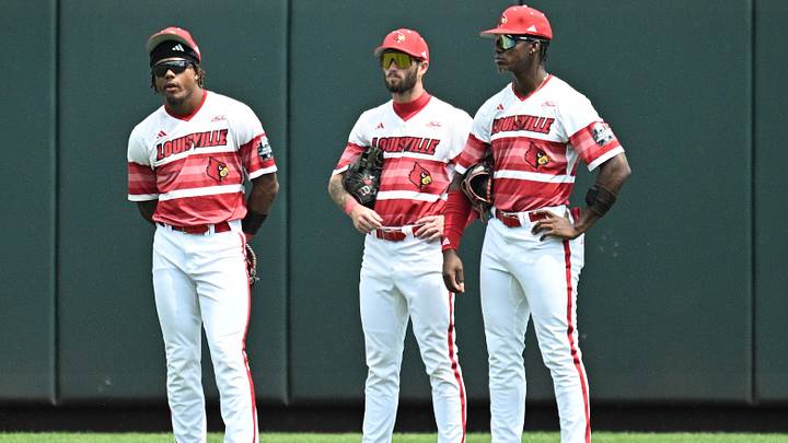 Jun 18, 2025: Louisville Cardinals left fielder Zion Rose (32), center fielder Lucas Moore (53), and right fielder Eddie King Jr. (42) wait out a pitching change sixth inning at Charles Schwab Field. 