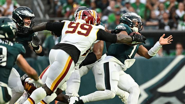 Sep 13, 2026; Philadelphia, Pennsylvania, USA; Washington Commanders defensive tackle Javon Kinlaw (99) sacks Philadelphia Eagles quarterback Jalen Hurts (1) during the second half at Lincoln Financial Field. Mandatory Credit: Eric Hartline-Imagn Images Sep 13, 2026; Philadelphia, Pennsylvania, USA; Washington Commanders defensive tackle Javon Kinlaw (99) sacks Philadelphia Eagles quarterback Jalen Hurts (1) during the second half at Lincoln Financial Field. Mandatory Credit: Eric Hartline-Imagn Images