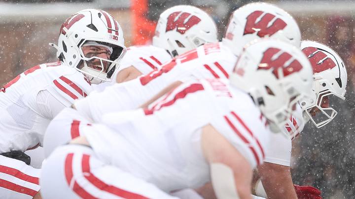 The Wisconsin Badgers offensive line gets set for a play. The Wisconsin Badgers offensive line gets set for a play.