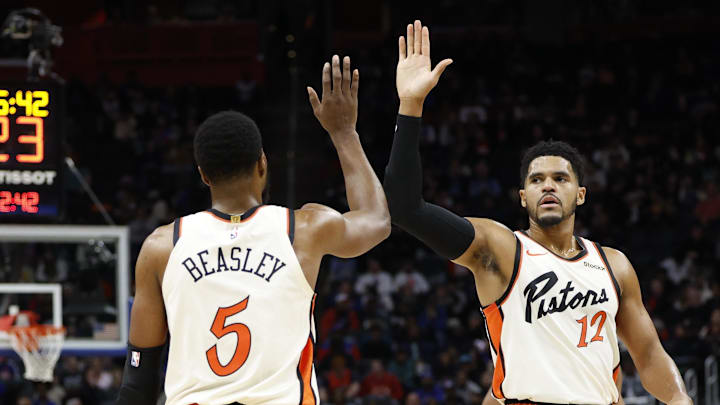 Nov 25, 2024; Detroit, Michigan, USA;  Detroit Pistons guard Malik Beasley (5) and forward Tobias Harris (12) celebrates in the first half against the Toronto Raptors at Little Caesars Arena. Mandatory Credit: Rick Osentoski-Imagn Images