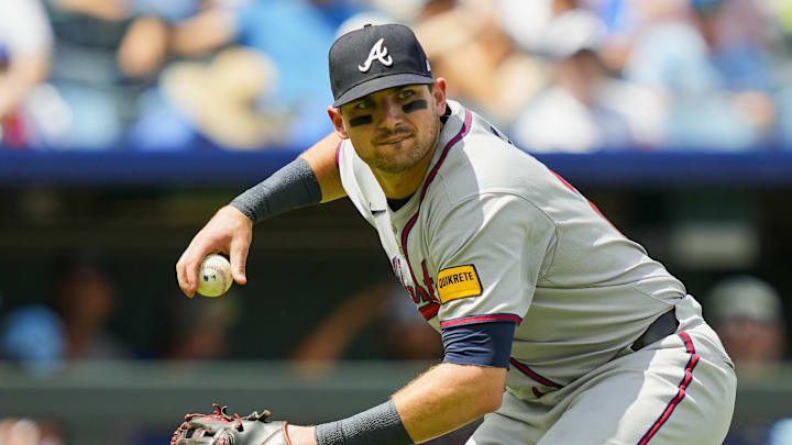 Jul 30, 2025; Kansas City, Missouri, USA; Atlanta Braves third baseman Austin Riley (27) throws to first base during the fifth inning against the Kansas City Royals at Kauffman Stadium. Mandatory Credit: Jay Biggerstaff-Imagn Images