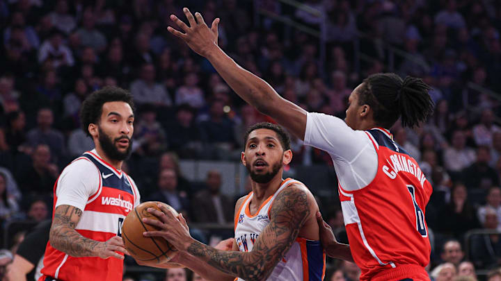 Mar 22, 2025; New York, New York, USA; Washington Wizards guard Colby Jones (1) drives to the basket after the game Washington Wizards guard Bub Carrington (8) and forward Justin Champagnie (9) during the first quarter at Madison Square Garden. Mandatory Credit: Vincent Carchietta-Imagn Images
