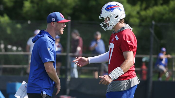 Bills QB Josh Allen talks with offensive coordinator Joe Brady during drills on day three of the Buffalo Bills training camp.