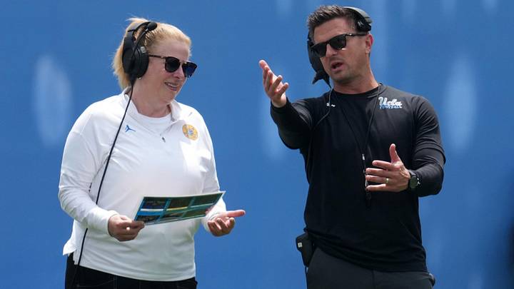 May 2, 2026; Pasadena, CA, USA; UCLA Bruins coach Bob Chesney (right) with women's basketball coach Cori Close during the spring game at Rose Bowl. Mandatory Credit: Kirby Lee-Imagn Images