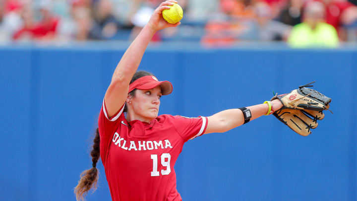 Oklahoma pitcher Nicole May (19) pitches in the first inning during a Women’s College World Series semifinal game between Oklahoma (OU) and Florida at Devon Park in Oklahoma City, on Monday, June 3, 2024.