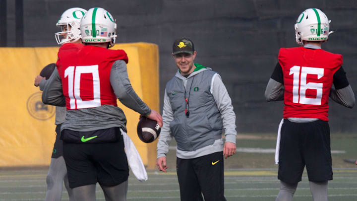 New Oregon offensive coordinator and quarterbacks coach Will Stein, center, leads a drill on the first practice of spring for Oregon football as the Ducks prepare for the 2023 season.

Eug 031623 Uo Spring Fb 12
