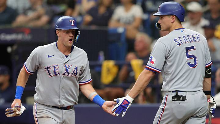 Oct 4, 2023; St. Petersburg, Florida, USA; Texas Rangers third baseman Josh Jung (6) high fives shortstop Corey Seager (5) after scoring a run against the Tampa Bay Rays in the sixth inning during game two of the Wildcard series for the 2023 MLB playoffs at Tropicana Field. Mandatory Credit: Nathan Ray Seebeck-USA TODAY Sports Oct 4, 2023; St. Petersburg, Florida, USA; Texas Rangers third baseman Josh Jung (6) high fives shortstop Corey Seager (5) after scoring a run against the Tampa Bay Rays in the sixth inning during game two of the Wildcard series for the 2023 MLB playoffs at Tropicana Field. Mandatory Credit: Nathan Ray Seebeck-USA TODAY Sports