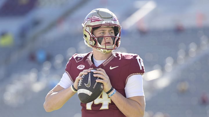 Nov 23, 2024; Tallahassee, Florida, USA; Florida State Seminoles quarterback Luke Kromenhoek (14) warms up before the game against the Charleston Southern Buccaneers at Doak S. Campbell Stadium. Mandatory Credit: Melina Myers-Imagn Images