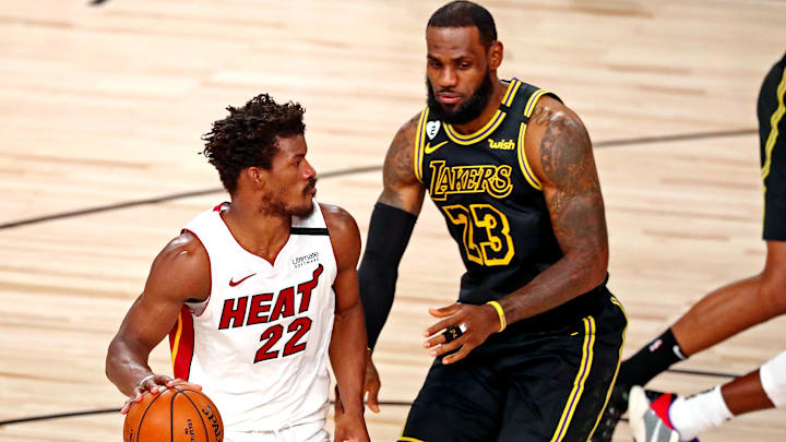 Oct 9, 2020; Lake Buena Vista, Florida, USA; Miami Heat forward Jimmy Butler (22) handles the ball against Los Angeles Lakers forward LeBron James (23) during the second quarter in game five of the 2020 NBA Finals at AdventHealth Arena. Mandatory Credit: Kim Klement-Imagn Images
