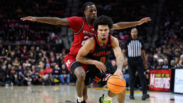 Feb 9, 2025; College Park, Maryland, USA; Maryland Terrapins guard Ja'Kobi Gillespie (0) drives to the basket against Rutgers Scarlet Knights guard Jeremiah Williams (25) during the second half at Xfinity Center. Feb 9, 2025; College Park, Maryland, USA; Maryland Terrapins guard Ja'Kobi Gillespie (0) drives to the basket against Rutgers Scarlet Knights guard Jeremiah Williams (25) during the second half at Xfinity Center.