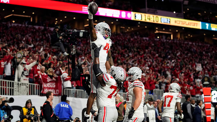 Ohio State Buckeyes wide receiver Jeremiah Smith (4) celebrates with offensive lineman Donovan Jackson (74) after a touchdown catch against Notre Dame Fighting Irish in the first quarter during the College Football Playoff National Championship at Mercedes-Benz Stadium in Atlanta on January 20, 2025. Ohio State Buckeyes wide receiver Jeremiah Smith (4) celebrates with offensive lineman Donovan Jackson (74) after a touchdown catch against Notre Dame Fighting Irish in the first quarter during the College Football Playoff National Championship at Mercedes-Benz Stadium in Atlanta on January 20, 2025.