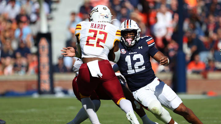 Nov 16, 2024; Auburn, Alabama, USA; Auburn Tigers linebacker Dorian Mausi Jr. (12) closes in on Louisiana Monroe Warhawks running back Ahmad Hardy (22) during the first quarter at Jordan-Hare Stadium. Mandatory Credit: John Reed-Imagn Images