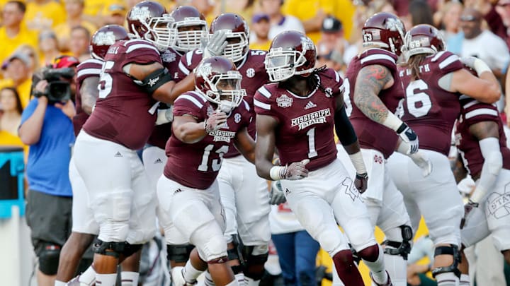 Sep 20, 2014; Baton Rouge, LA, USA; Mississippi State Bulldogs wide receiver De'Runnya Wilson (1) celebrates with teammates after scoring a touchdown against the LSU Tigers during the first quarter of a game at Tiger Stadium. Mandatory Credit: Derick E. Hingle-Imagn Images
