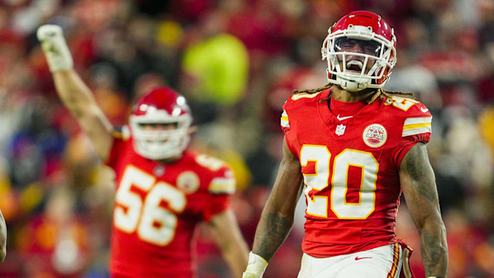 Nov 29, 2024; Kansas City, Missouri, USA; Kansas City Chiefs safety Justin Reid (20) and defensive end George Karlaftis (56) celebrate after a play during the second half against the Las Vegas Raiders at GEHA Field at Arrowhead Stadium. Mandatory Credit: Jay Biggerstaff-Imagn Images