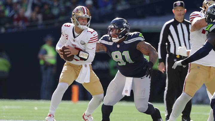 Oct 11, 2026; Seattle, Washington, USA;  Seattle Seahawks defensive tackle Byron Murphy II (91) rushes against San Francisco 49ers quarterback Brock Purdy (13) during the first half at Lumen Field.  Mandatory Credit: Joe Nicholson-Imagn Images