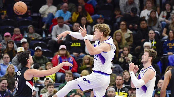 Oct 16, 2025; Salt Lake City, Utah, USA; Utah Jazz forward/center Lauri Markkanen (23) makes a quick pass over Portland Trail Blazers during the first half at Delta Center. Mandatory Credit: Peter Creveling-Imagn Images