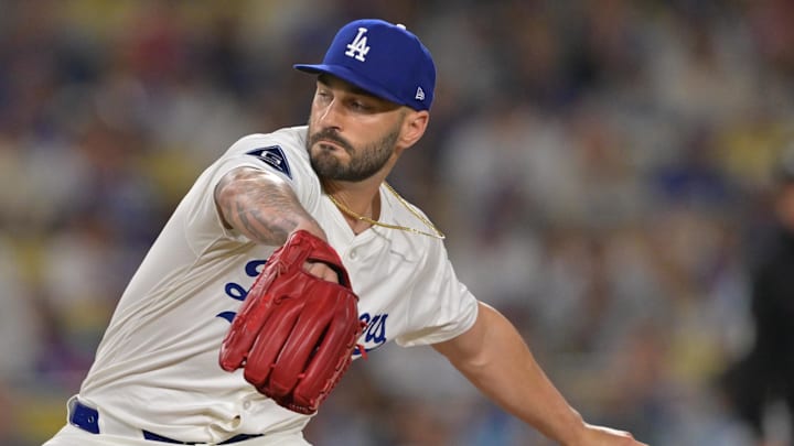Sep 17, 2025; Los Angeles, California, USA;  Los Angeles Dodgers relief pitcher Tanner Scott (66) earns a save in the ninth inning against the Philadelphia Phillies at Dodger Stadium. Mandatory Credit: Jayne Kamin-Oncea-Imagn Images