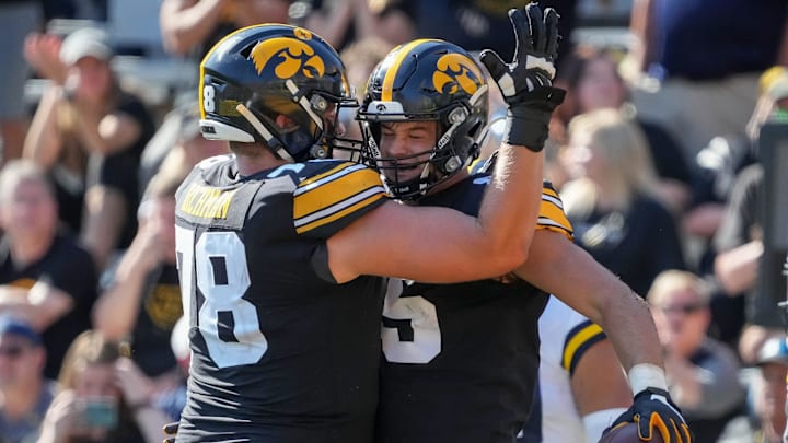 Iowa tight end Luke Lachey, right, celebrates with teammate Mason Richman after scoring a touchdown in the fourth quarter against Michigan during a NCAA college football game at Kinnick Stadium in Iowa City on Saturday, Oct. 1, 2022.

Iowavsmichiganfb 20221001 Bh