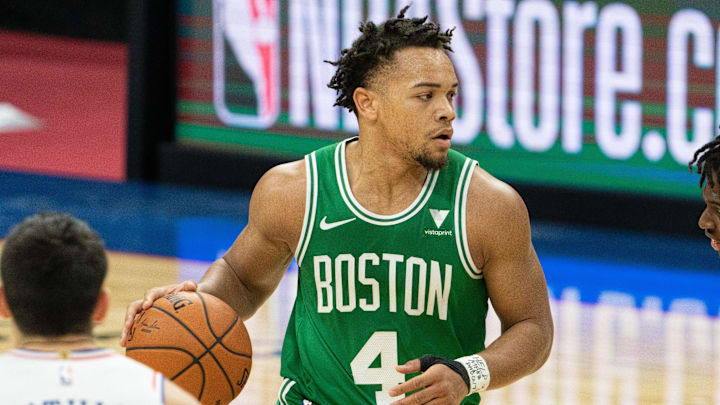 Dec 15, 2020; Philadelphia, Pennsylvania, USA; Boston Celtics guard Carsen Edwards (4) dribbles against the Philadelphia 76ers during the fourth quarter at Wells Fargo Center. Mandatory Credit: Bill Streicher-Imagn Images