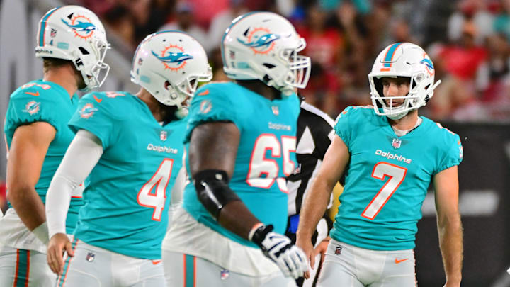 Robert Jones, pictured here (65) on the field goal team in 2022, becomes the second and final restricted free agent to agree to terms with the Miami Dolphins this off season. 