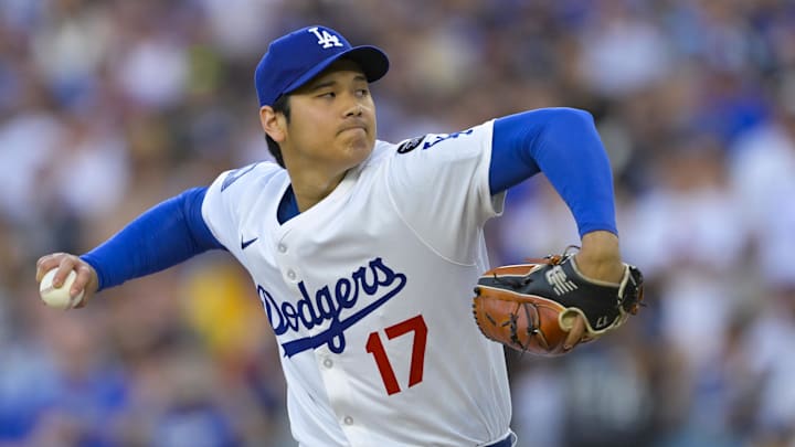 Los Angeles Dodgers designated hitter Shohei Ohtani (17) throws against the San Diego Padres during the first inning at Dodger Stadium.