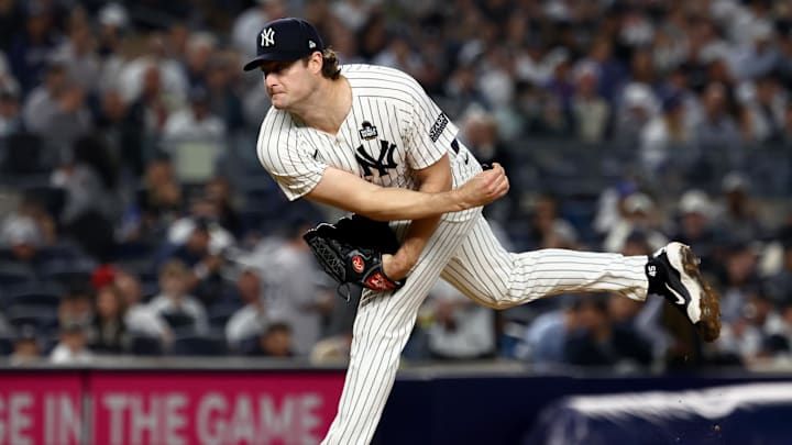 Oct 30, 2024; New York, New York, USA; New York Yankees pitcher Gerrit Cole (45) throws during the fourth inning against the Los Angeles Dodgers in game five of the 2024 MLB World Series at Yankee Stadium. Mandatory Credit: Vincent Carchietta-Imagn Images