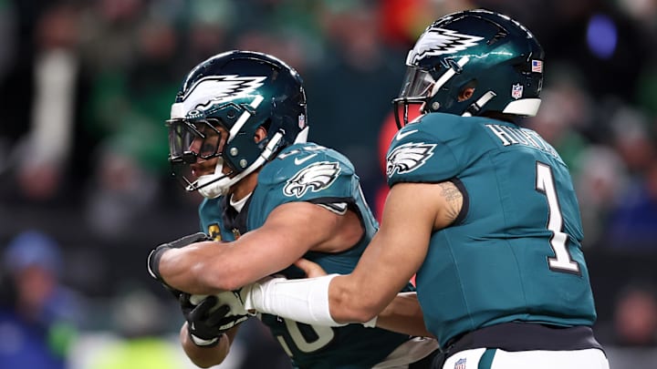 Jan 11, 2026; Philadelphia, PA, USA; Philadelphia Eagles quarterback Jalen Hurts (1) hands the ball to running back Saquon Barkley (26) against the San Francisco 49ers during the second quarter in an NFC Wild Card Round game at Lincoln Financial Field. Mandatory Credit: Bill Streicher-Imagn Images
