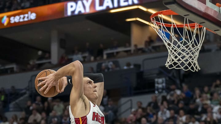 Nov 10, 2024; Minneapolis, Minnesota, USA; Miami Heat guard Tyler Herro (14) drives to the basket and dunks the ball against the Minnesota Timberwolves in the second half at Target Center. Mandatory Credit: Jesse Johnson-Imagn Images