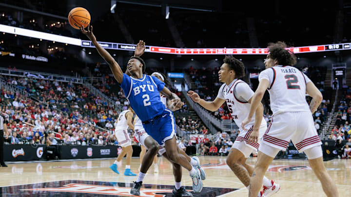 Mar 14, 2024; Kansas City, MO, USA; Brigham Young Cougars guard Jaxson Robinson (2) shoots the ball while getting fouled against Texas Tech.