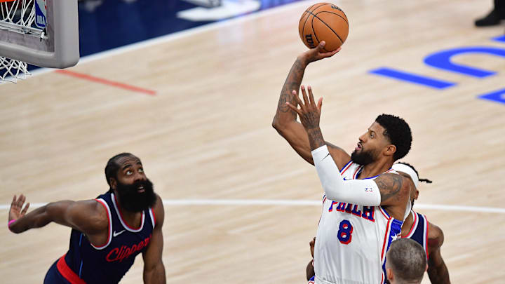 Nov 6, 2024; Inglewood, California, USA; Philadelphia 76ers forward Paul George (8) shoots against Los Angeles Clippers guard James Harden (1) during the second half at Intuit Dome. Mandatory Credit: Gary A. Vasquez-Imagn Images