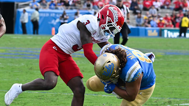 Nov 30, 2024; Pasadena, California, USA; Fresno State Bulldogs defensive back Al'zillion Hamilton (3) tackles UCLA Bruins tight end Moliki Matavao (88) during the second quarter at Rose Bowl. Mandatory Credit: Robert Hanashiro-Imagn Images