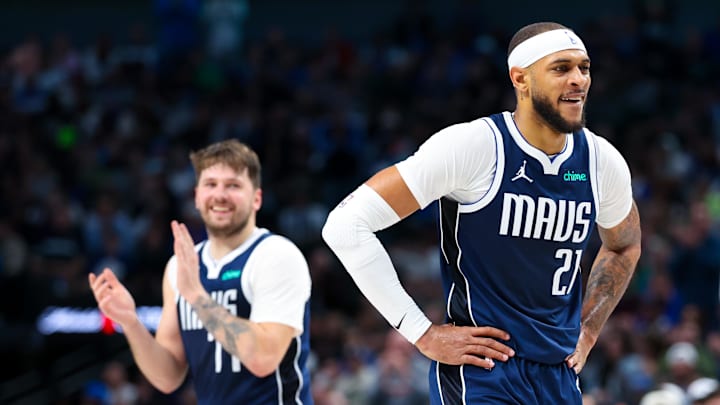 Feb 10, 2024; Dallas, Texas, USA; Dallas Mavericks guard Luka Doncic (77) claps for Dallas Mavericks center Daniel Gafford (21) during the second half against the Oklahoma City Thunder at American Airlines Center. Mandatory Credit: Kevin Jairaj-Imagn Images