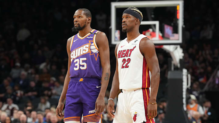 Nov 6, 2024; Phoenix, Arizona, USA; Phoenix Suns forward Kevin Durant (35) and Miami Heat forward Jimmy Butler (22) look on during the first half at Footprint Center. Mandatory Credit: Joe Camporeale-Imagn Images