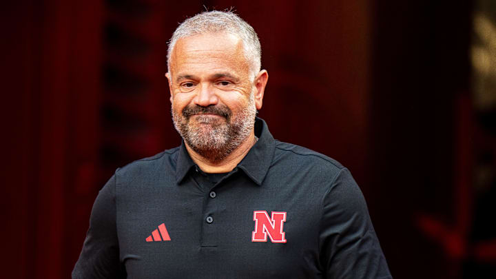 Aug 28, 2025; Kansas City, Missouri, USA; Nebraska Cornhuskers head coach Matt Rhule walks onto the field during warmups before the game against the Cincinnati Bearcats.