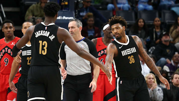Jan 3, 2024; Memphis, Tennessee, USA; Memphis Grizzlies guard Marcus Smart (36) reacts with Memphis Grizzlies forward-center Jaren Jackson Jr. (13) during the second half against the Toronto Raptors at FedExForum. Mandatory Credit: Petre Thomas-Imagn Images