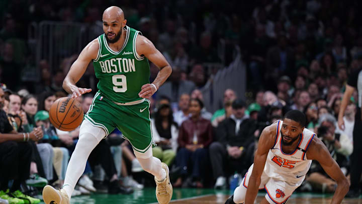May 7, 2025; Boston, Massachusetts, USA; Boston Celtics guard Derrick White (9) and New York Knicks forward Mikal Bridges (25) work for the ball in the second quarter during game two of the second round for the 2025 NBA Playoffs at TD Garden. Mandatory Credit: David Butler II-Imagn Images